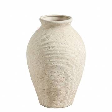 Close-up of a rustic ivory ceramic vase with a textured matte finish on a wooden table.